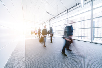 blurred business people at a trade fair stock photo