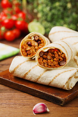 Burritos wraps with meat, beans and vegetables.