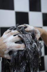 Woman on her back washing her hair