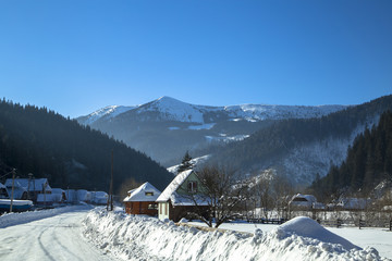 Wooden Home in the mountains. Winter Carpathian mountains