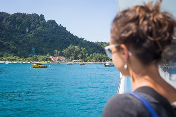 Fototapeta premium Girl admiring a beautiful sea view