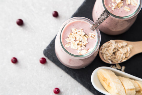 Smoothie of banana and cranberries with yogurt and oats 