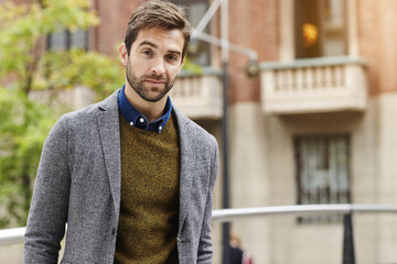 Portrait of guy in grey jacket