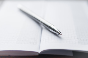 Notebook and Pen, Notebook and pen on white background.