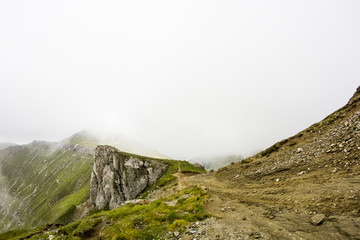 Landscape from Bucegi Mountains, part of Southern Carpathians in Romania in a foggy day