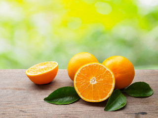 Fresh orange fruit group and orange cutting half with leaf on wo