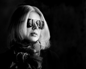monochrome young woman in sunglasses
