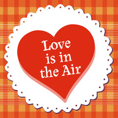 Abstract colorful background with red heart and the text love is in the air written with white letters