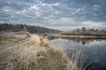 Autumn Field in frost. Dawn. River.
