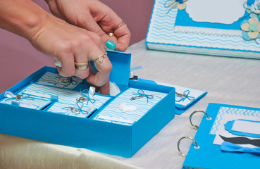 Baby party. Making children's party boy, invitations, postcards. Close-up. Mama's treasures.
