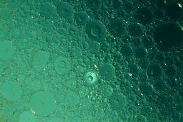 Oil and water abstract/  Oil and water are two liquids that will not mix together