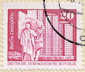 UKRAINE - CIRCA 2017: A stamp printed in GDR, shows Lenin monument, residential tower, Berlin, the...