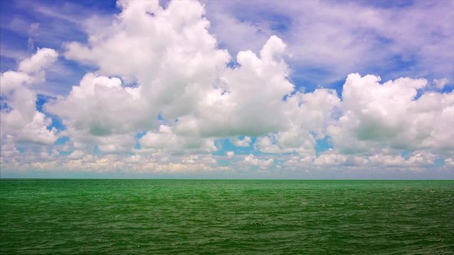 Cinemagraph Loop - Tropical Ocean Water and Blue Sky with Clouds - Time Lapse