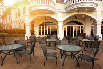 Empty tables at an outdoor restaurant