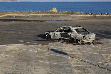 Fototapeta na wymiar Abandoned, stolen burned out car