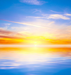 Naklejka na ściany i meble Sunset reflected in a water 