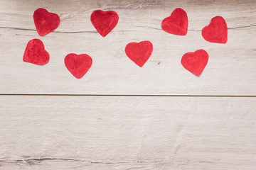 Obraz na płótnie Canvas red heart on a wooden background