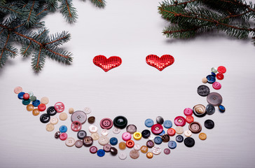 The white board with lots of buttons set out in a smile, Valenti