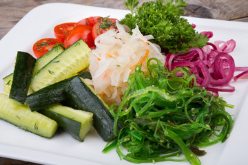 Pickeled vegetables on a white plate