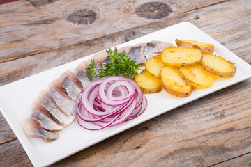 Sliced herring with potatoes