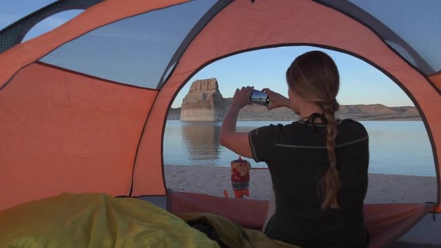 Girl Taking Pictures with Phone Tent Camping Lone Rock Campground Lake Powell Wahweap Bay Kane County Utah United States