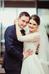 The brides embracing in the room