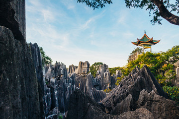 Colorful sunset in Stone Forest in Shilin, Yunnan Province, South China, not far from the  Kunming....