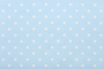 Pastel blue polka dot fabric macro, texture background