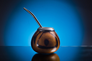 Kalabas isolated on blue gradient background. The ceremony of drinking yerba mate