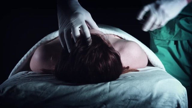 4K Crime Morgue Mortician Examining Dead Body