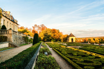 Castle of Auvers-sur-Oise in garden. Sunset. Val-d'Oise, France.