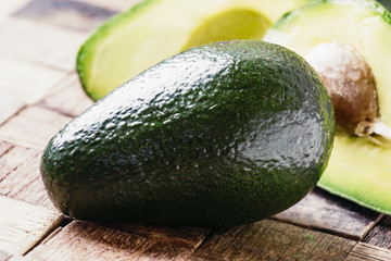 Fresh avocado on vintage wooden table, selective focus