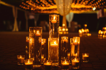 The vases with candles stand for wedding ceremony