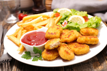 chicken or fish nugget with french fries