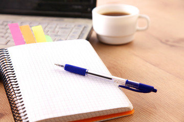 on the desktop computer and a cup of coffee