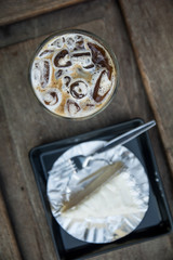 Coffee & cake on wooden table background in breakfast meal