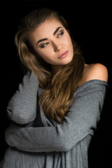 Fashionable and beautiful girl with long hair. Perfect make-up