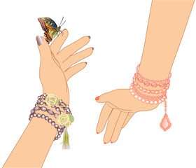 woman's hands with bracelets of beads and a butterfly
