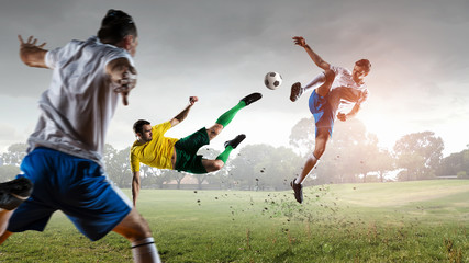 Obraz na płótnie Canvas Soccer player outdoors . Mixed media