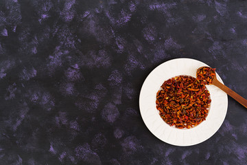 Different spices on dark background. Top view.