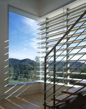 View of a landscape from glass walls in a house in California, USA