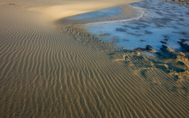 Sand dunes on river coast