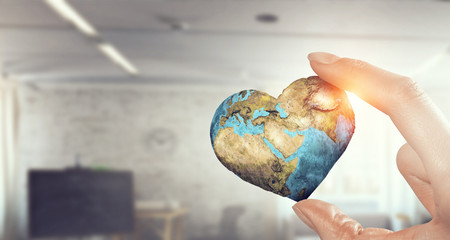 Whole world in hand . Mixed media