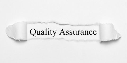 Quality Assurance on white torn paper