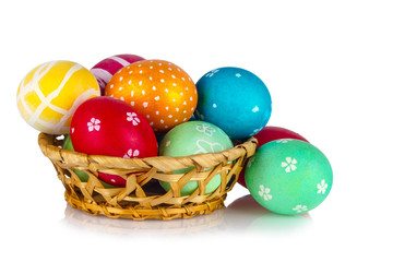 basket with Easter eggs on a white background