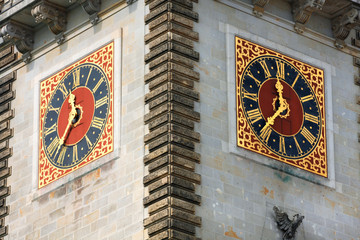 Beautiful clock on two sides on famous Hamburg city hall building.