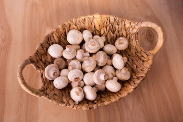 Fresh champignons in basket