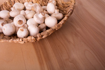 Fresh champignons in basket