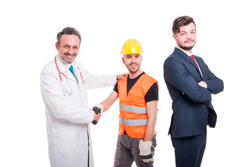 Businessman near medic and engineer offering handshake