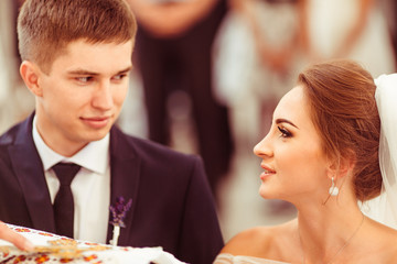 The brides stands in the church